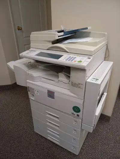 Selling a RICOH Aficio MP 2510 printer that prints in black and white. It comes with 4 paper trays,...