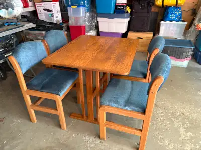 Solid oak table and chair set with 4 chairs excellent condition 2 chairs fold up so can be stored aw...