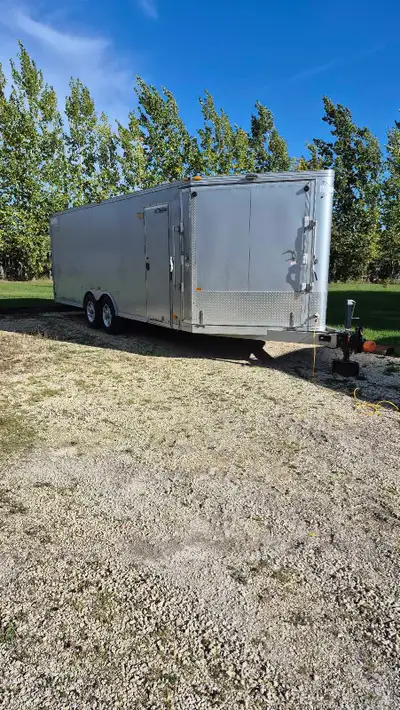 2010 Mission aluminum snowmobile/car trailer. Has tie downs for car or snowmobiles. 22'box+4'noise+3...