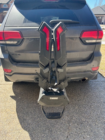 Thule Epos bike rack, holds 2 electric bikes, fits 2 inch receiver. Folds down to allow access to re...