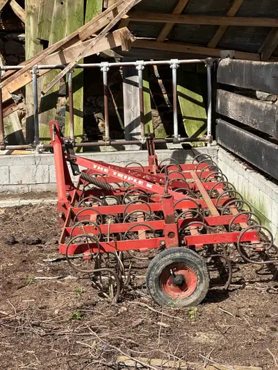 10 foot wide solid metal cultivator attachment. “The triple K”