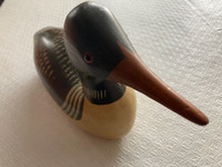 Vintage wooden hand-carved loon decoy.
