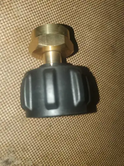 This is a used propane tank adapter fitting, in good condition, that allows you to connect your smal...
