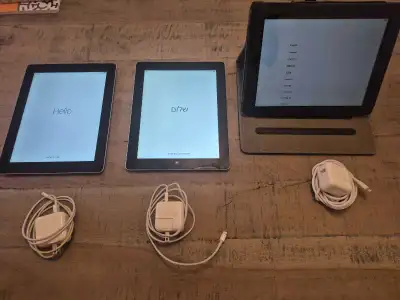 3 iPads in good condition , one with case. charger included, View more