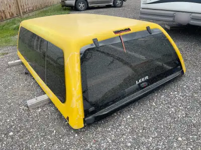 1999-2016 Ford F250/F350 canopy. Paint is in poor condition but I doubt you’d keep it yellow anyways...