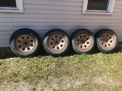 Four rims Three tires as one has broken belts Off 2009 Silverado