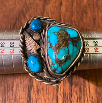 Men’s unsigned sterling and turquoise ring .