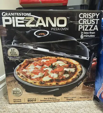 Enjoy delicious stone-baked pizza at home with the Piezano Electric Pizza Oven. This brand new, neve...