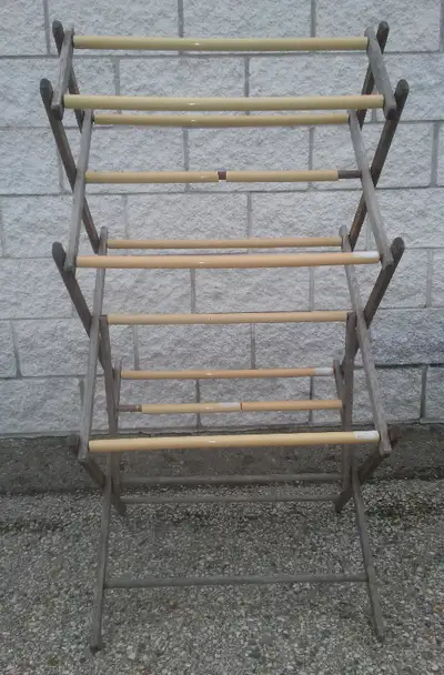 Vintage accordion drying rack for sundry uses. Sturdy. So far has only been used for drying clothes....