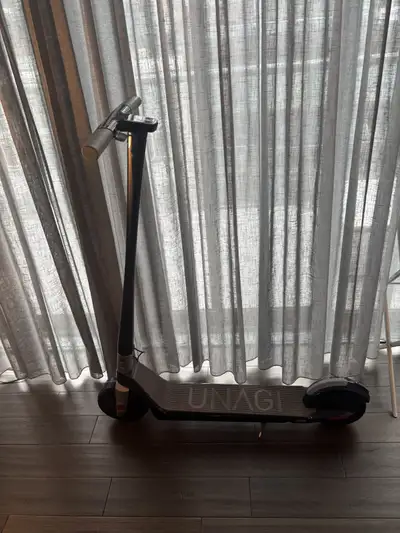 Electric Scooter used less than 10 times (practically new). Brand is Unagi. Current market value $1,...