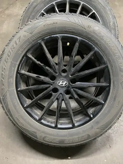 Up for sale are these used Hyundai tiers with rims, sized at 225/60R17, offering reliable performanc...