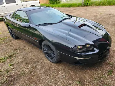 2001 Camaro SS black on black T Tops auto safetied. Would consider trade for fuel injected family bo...
