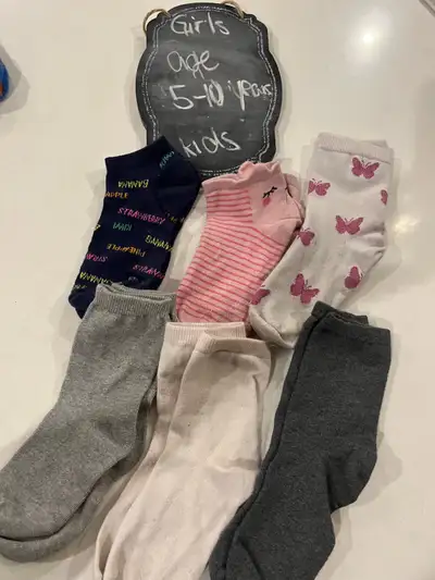 Lot of girls socks fits ages 7-10 years Preowned no holes or rips. A few pairs were never worn at al...