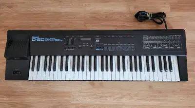 Roland D-20 multi-timbral linear synthesizer. This black 61 Seni- weighted key keyboard has a built-...