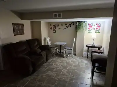 Furnished room in a basement unit has seperate entrance Shared kitchen and bathroom Fridge and stove...