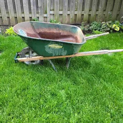 This is a used Yardworks wheelbarrow perfect for gardening and landscaping tasks, featuring a sturdy...