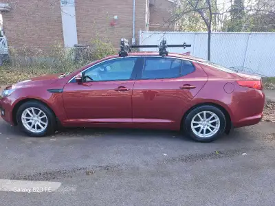 Drive in style without breaking the bank! This 2012 Kia Optima is a perfect mix of reliability, comf...
