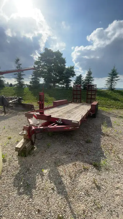 Tandem axle utility trailer. 18’ x 6’ Pintle hitch, electric brakes, ramps, straps. Will need new ti...