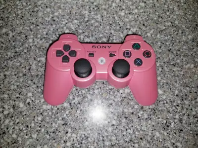 Here's an official Sony PS3 Dualshock controller, it's pink and still in good condition. I just don'...