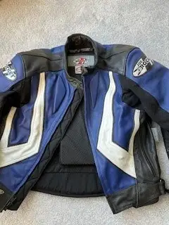 Selling a genuine Joe Rocket "Blaster" leather motorcycle jacket in a sharp blue, black, and off-whi...