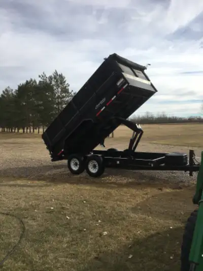 7 x 14 Dump Trailer for rent. 14000 pound axles. 21 inch extensions. No large rocks, concrete or met...