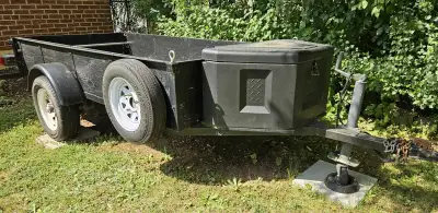 4ft. x 8ft. Utility trailer. Tubular steel frame construction with plywood floor and sides. Hinged a...