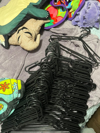 All black clothes hangers