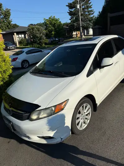 This 2012 Honda Civic is a reliable and sporty manual transmission sedan that features an upgraded t...