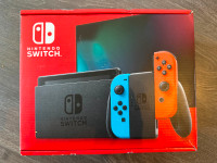 Brand New Nintendo Switch with Neon blue and Neon Red Joy-con