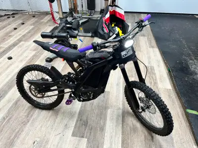As new very little km with some purple ad ons. Comes with charger, front fender and orig seat cover...