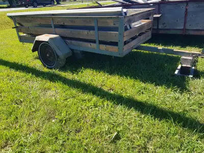 utility trailer 52 1/2 x 106 inches. wooden side had been replace not to long ago