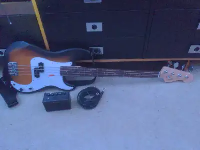 Squire fender bass guitar with Donner Amp, Adjustable Strap And Amp Cable amp is not high end but ge...