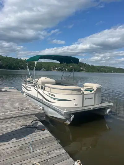In the water and ready for a test drive. 20 foot Legend pontoon boat model 2000 classic fisherman. W...