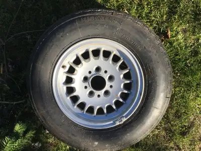 One new BMW rim with NOS 205/70 VR14 Michelin XWX high speed tire $200....One Mercedes 15 inch rim w...