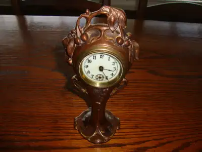 EARLY 1900'S BRONZE TABLE CLOCK, View more