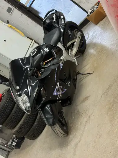 Rev up your engines for this sleek black Suzuki Hayabusa GSXR 1300, a true beast on two wheels! This...