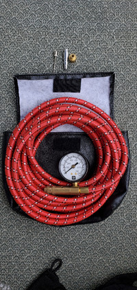 Inflation hose with built in gauge and adapters