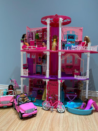 Barbie house , dolls, and accessories