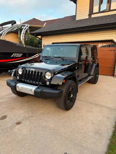 2014 Jeep Wrangler Unlimited Sahara, Pavement Princess, Barely even seen gravel roads. Features Jeep...