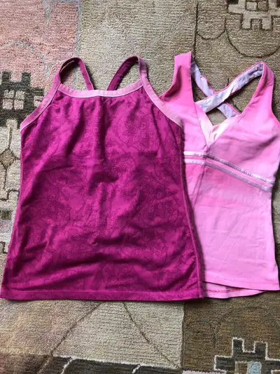 Two Lululemon tanks for sale. Both have shelf bra. Asking $10 each, or take both for $15. The light...