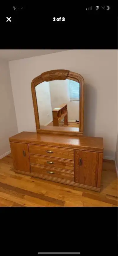 This vintage dresser with mirror is a solid wood piece, perfect for adding character to any bedroom....