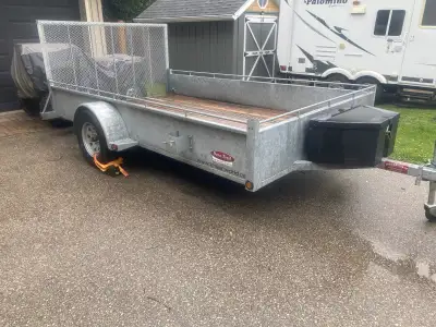 2023 Dura Trail 12’ trailer. Removable ramp, Tiedown rails, storage box. Only used for ATV and Side...