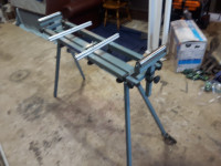folding stand for a sliding compound mitre saw