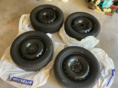 A set of Michelin X-Ice Xi3 snow tires on steel rim Size: 235/50/R18 A lot of tread left, see pictur...