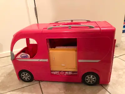 Used but in excellent condition. A couple small accessories are missing. Barbie camper lets your chi...