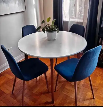 Upgrade your dining area with this stylish round dining table, perfect for cozy gatherings and every...