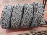 4 General Altimax 235/65R17 winter tires on rims