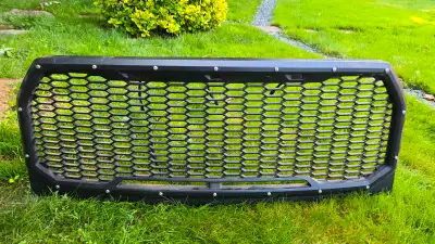 Used aftermarket main grill. Black raptor style. Good condition. Located in lower sackville ns