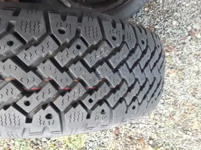 4 14inch Winter tires for sale. 2 studded P185/70R14 2 non studded P185/70R14 $125.00 for all 4 tire...