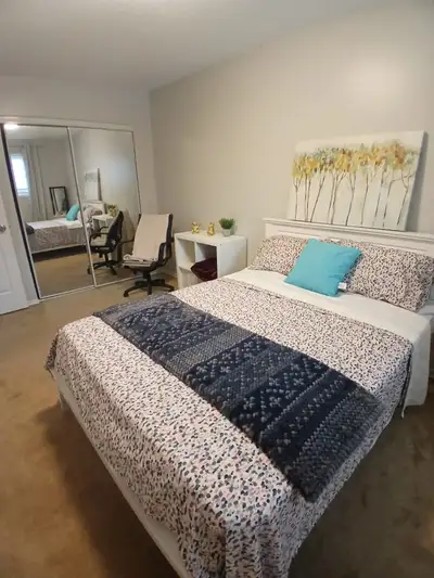 Shared accommodation bedroom on the upper floor of a house with a large closet, large window and ple...